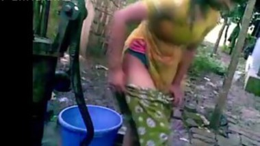 Bangladeshi deshi girl bathing outdoor