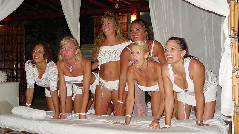 Group of naked brunette teens goes on vacation with no clothes public nude.